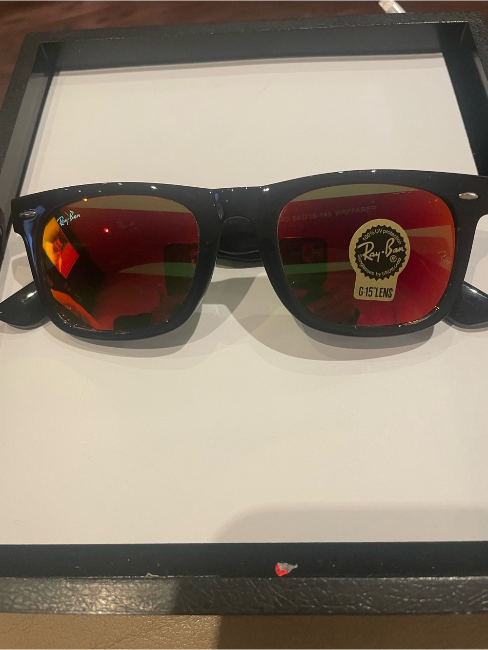 Ray-Ban Black Frame Sunglasses with Red/Orange Mirrored Lenses